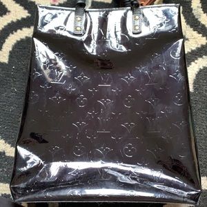 Authentic Louis Vuitton- no “charm” included